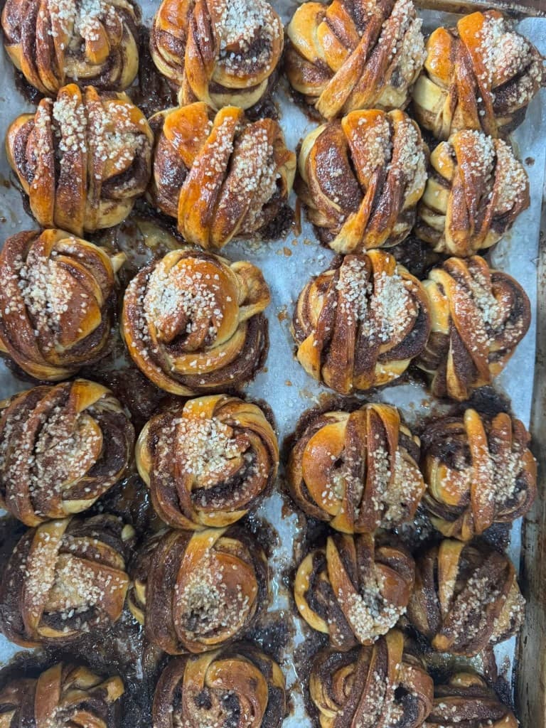 Freshly baked Swedish cardamom buns with pearl sugar