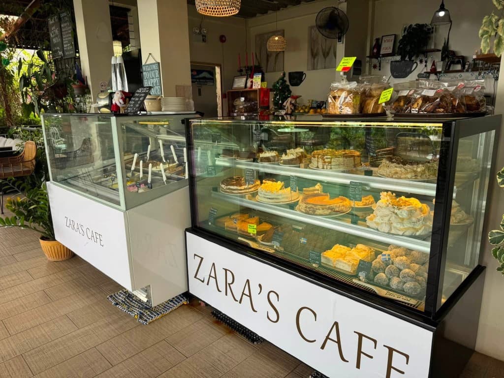 Interior of Zara's Cafe with gelato and dessert display cases