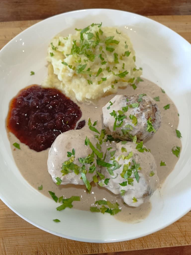 Swedish meatballs with mashed potatoes, gravy, and lingonberry jam